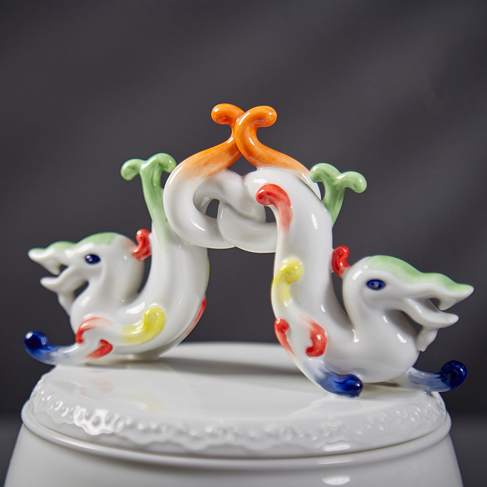 Close-up of intertwined dragons guarding a pearl, showcasing Heinrich Wang’s sculptural finesse